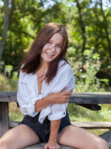 Skye Bloom Perching On A Picnic Table In The Park