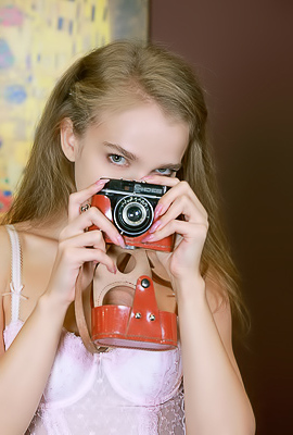 Xenia Glancing Back Over Her Shoulder With A Flirtatious Smile