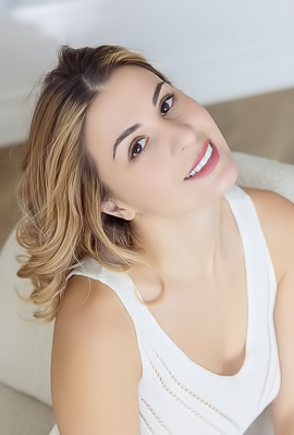 Alice Kelly Dark-eyed Siren Smiles Enticingly As The Straps Slide From Her Shoulders