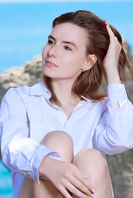 Nika Smiling With Pleasure As The Stimulating Ocean Breeze Caresses Her Sexy Body