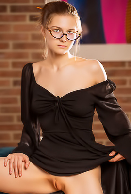 Ozzy Short Hair And Glasses Reading On The Couch