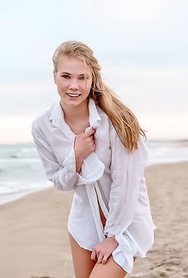 Luise Entices With A Beach Striptease Revealing Perky Nipples And Grabbing Her Curves