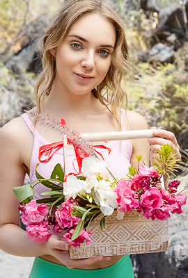 Oxana Chic Shows Off In Crop Top Gathering Flowers, Teasing View Under Shorts